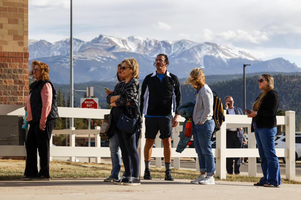 People wait outside of the Woodland Park School District Administration building to attend a school board meeting on April 12, 2023 in Woodland Park, Colo.  (Michael Ciaglo for NBC News)