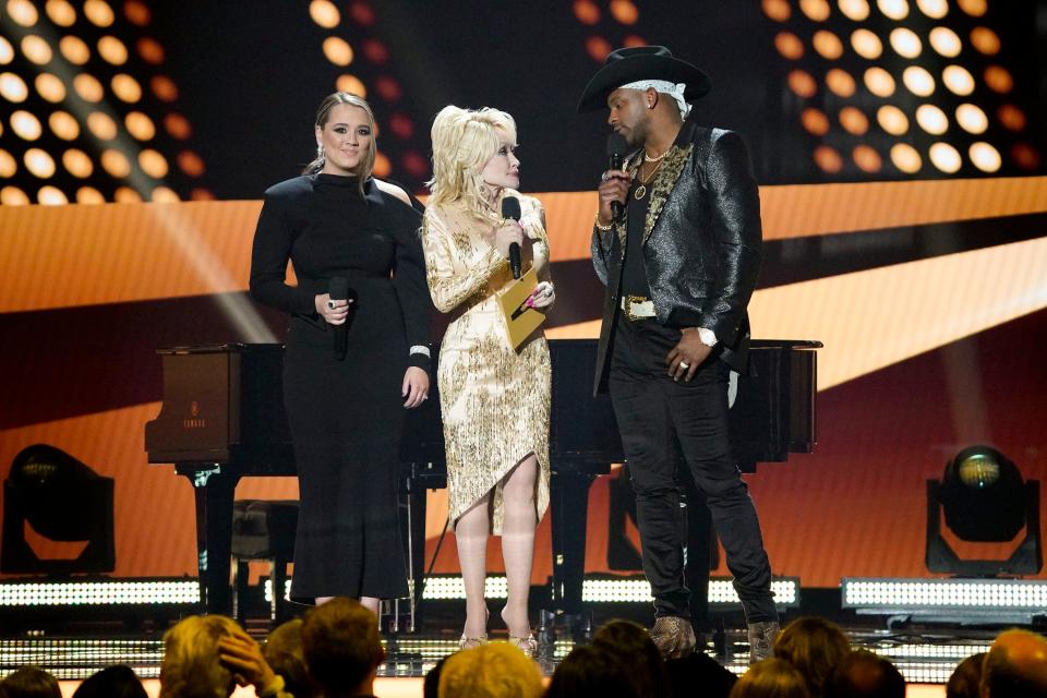 Gabby Barrett, Dolly Parton and Jimmie Allen appear on stage during the 57th Academy of Country Music Awards at Allegiant Stadium in Las Vegas, Nev., Monday, March 7, 2022.
