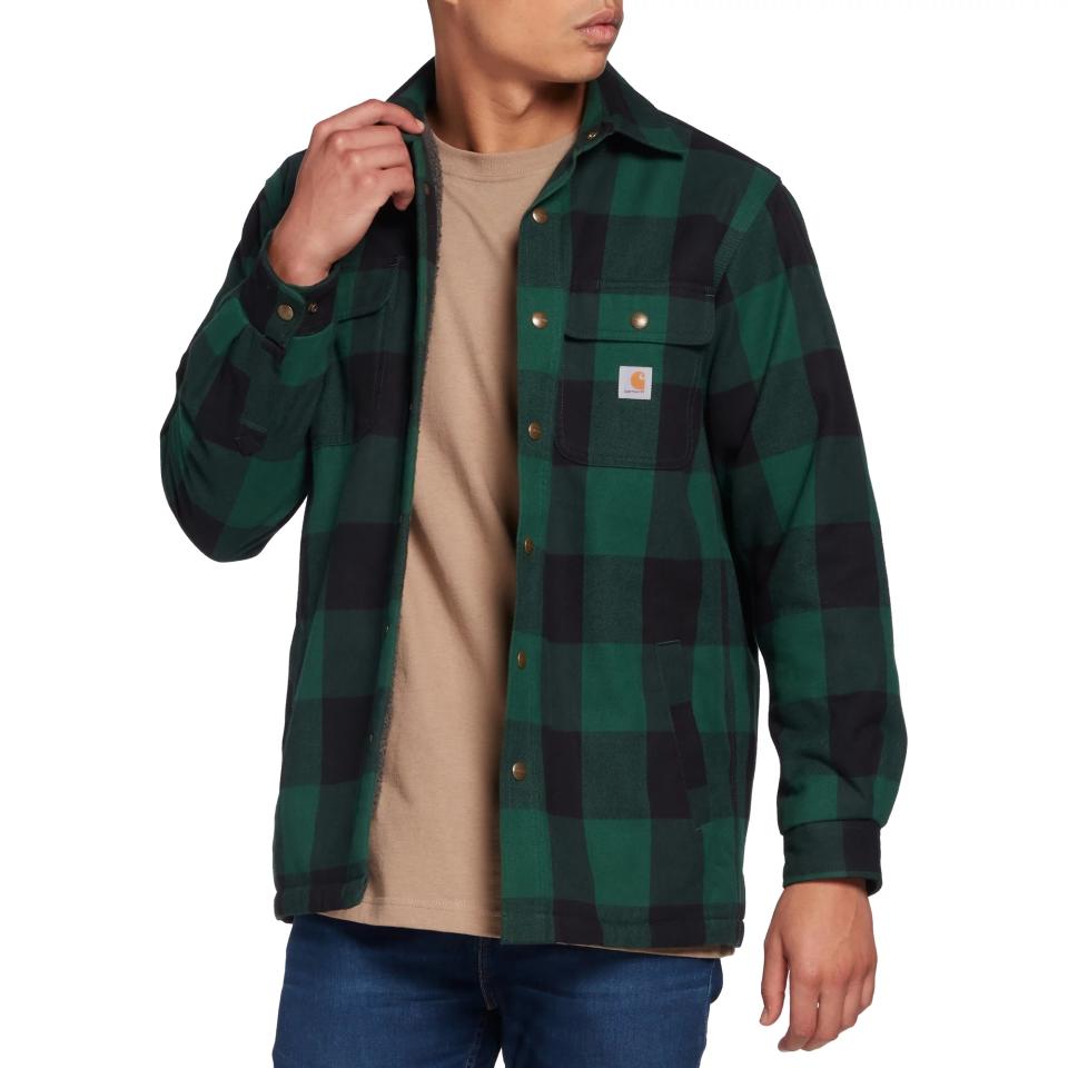 Man wearing green Carhartt Flannel Jacket and taupe shirt