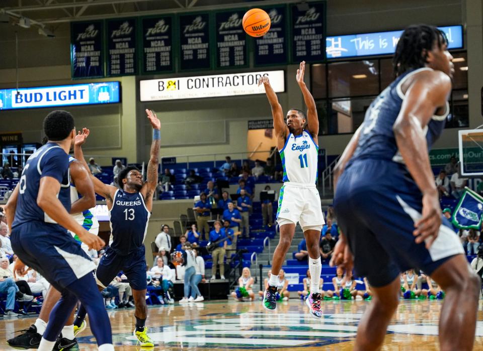 Florida Gulf Coast Eagles guard Isaiah Thompson (11) shoots a three point basket during the second half of an ASUN conference game against the Queens Royals at Alico Arena in Fort Myers on Saturday, Feb. 24, 2024.