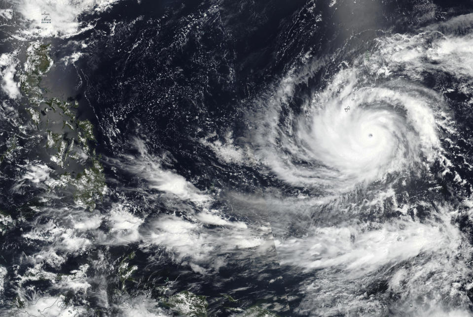 This Tuesday, May 23, 2023 satellite image released by NASA shows Typhoon Mawar, a powerful storm that could deliver the biggest hit in two decades to the U.S. territory in the Pacific, approaching Guam. (NASA via AP)