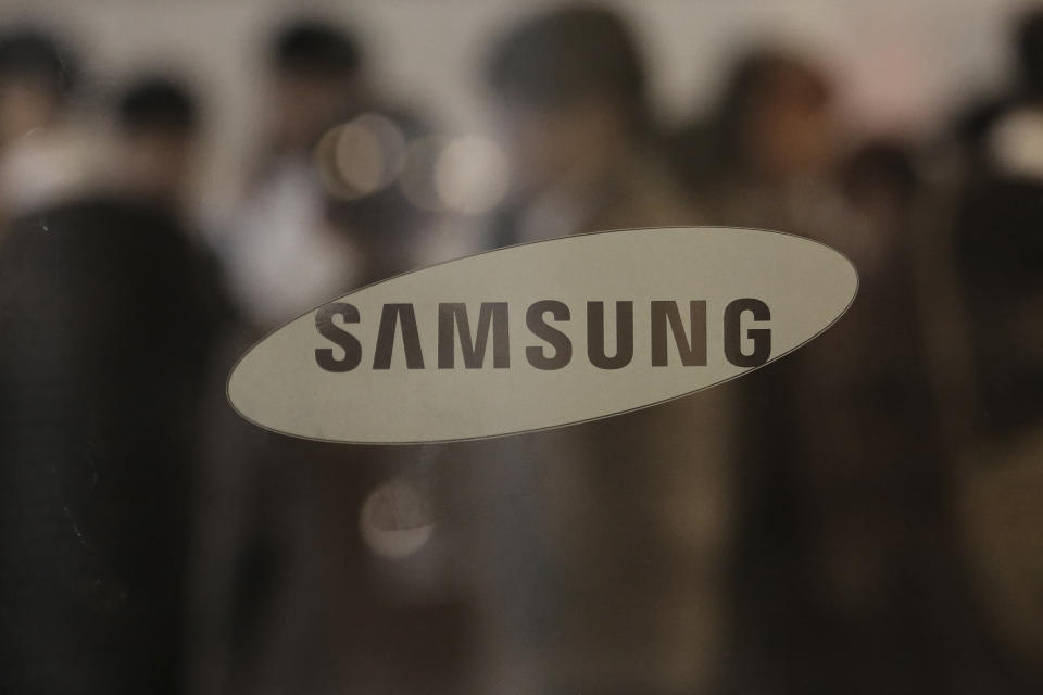 The logo of the Samsung Electronics Co. is seen at its office in Seoul, South Korea, Thursday, Oct. 31, 2019. Samsung Electronics said it operating profit for the last quarter fell by nearly 56%, with its robust sales of smartphone, displays and TVs offset by a continuously weak market for computer chips. (AP Photo/Ahn Young-joon)