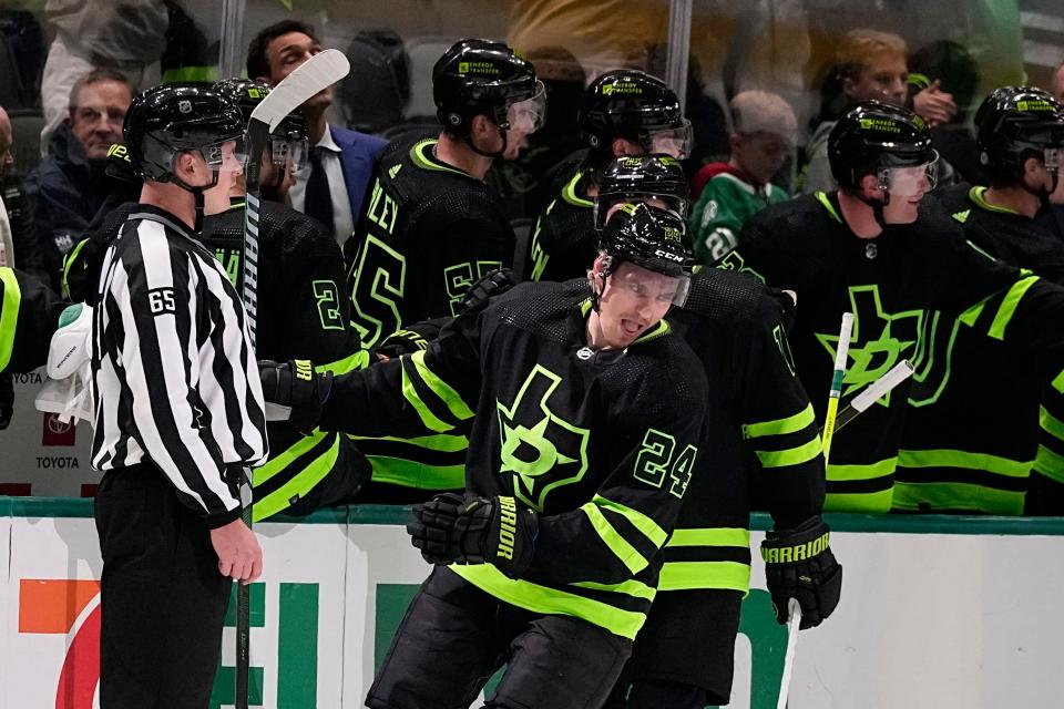 Dallas Stars center Roope Hintz (24) celebrates with the bench after scoring in the second period of an NHL hockey game against the Columbus Blue Jackets, Monday, Oct. 30, 2023, in Dallas. (AP Photo/Tony Gutierrez)