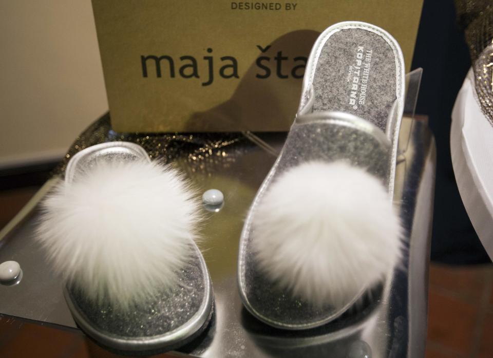 A pair of "White House" slippers produced at a local shoe factory is displayed in Sevnica, Slovenia, Friday, Jan. 20, 2017. The inauguration of Donald Trump is a big thing for a small town in Slovenia where the future U.S. first lady traces her roots. Starting Friday, the industrial town of Sevnica plans three days of events to mark the inauguration and welcome all guests wishing to see where Melania Trump grew up. (AP Photo/Darko Bandic)