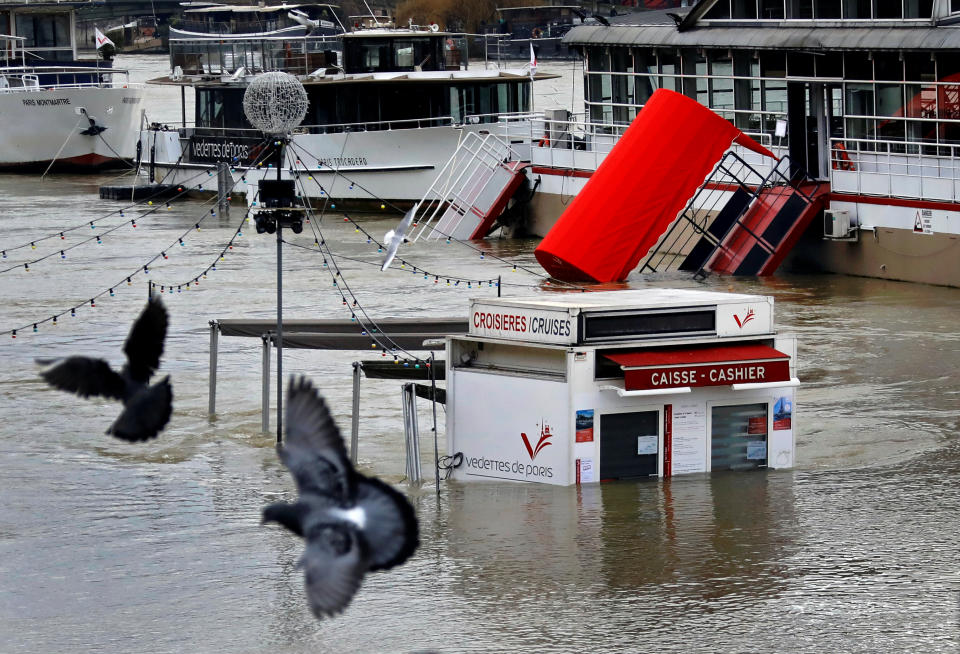 <p>A ticket booth for sightseeing boats is partly submerged by the River Seine after days of almost non-stop rain caused flooding in the country, in Paris, France, Jan. 27, 2018. (Photo: Pascal Rossignol/Reuters) </p>