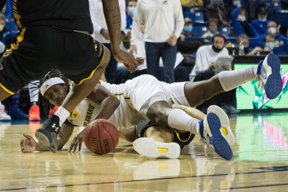 Delaware's Ryan Allen (2) eyes a loose ball late in the second half in their game against Towson Monday, Jan 24, 2022, at The Bob Carpenter Center. Towson defeated Delaware 69-62.