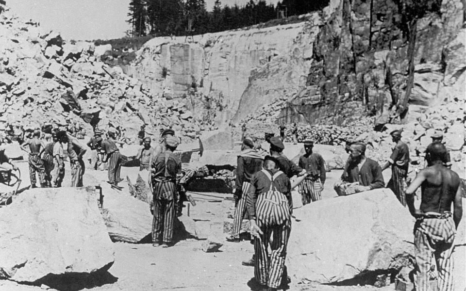 Prisoners performing forced labour at Mauthausen camp in Austria - USHMM