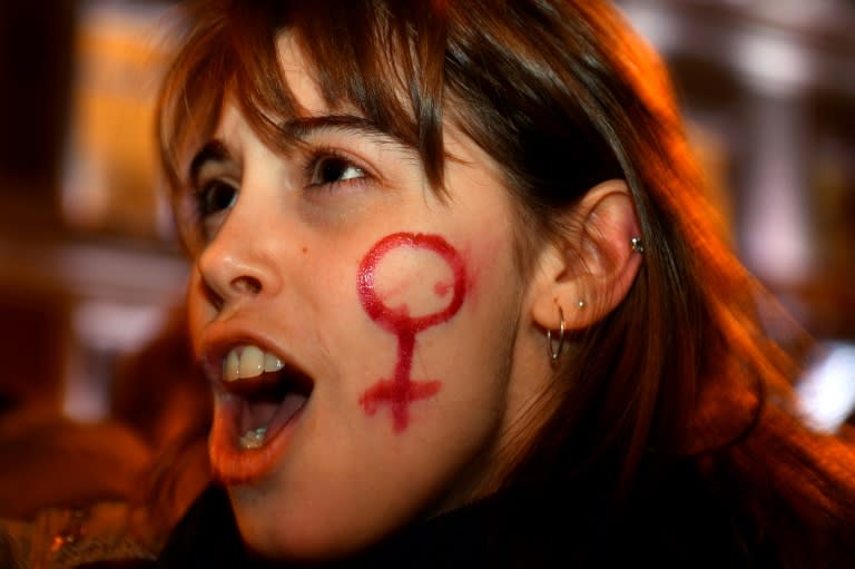 A woman sporting a venus symbol shows her support at a rally in Madrid protesting against last month's electoral success by far right party VOX which for the first time captured seats in a regional legislature on a nationalist, anti-feminist agenda