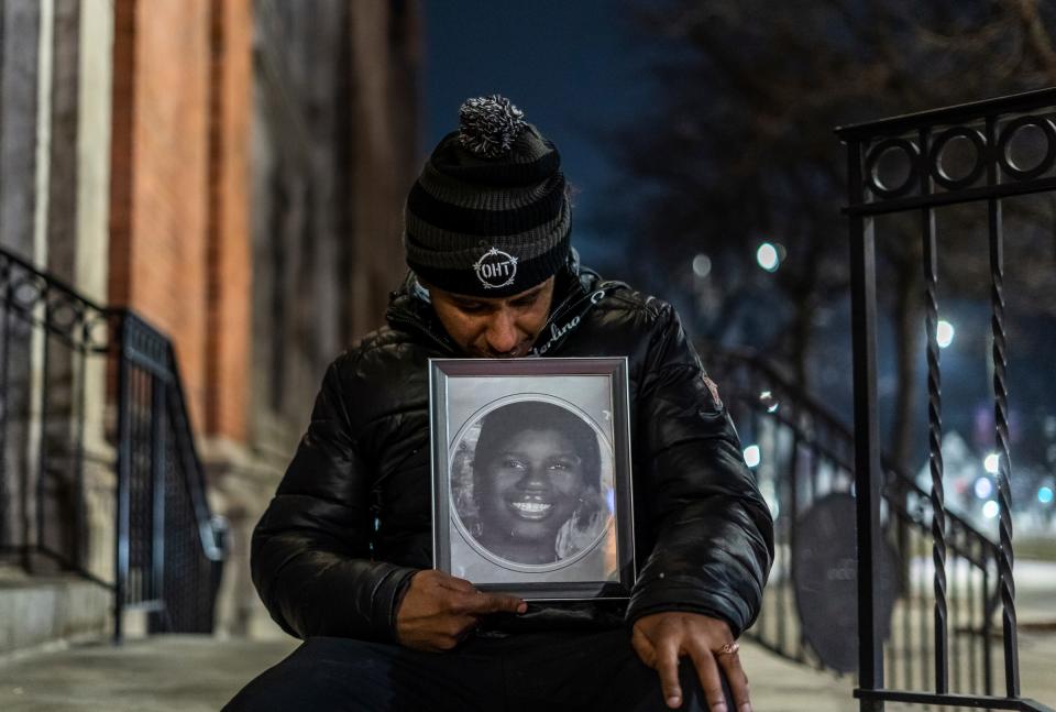 Samuel Lewis, 53, of Detroit sits with a younger photo of his child's mother Alanna Wilkins who died in September of 2022 while homeless following the annual Pope Francis Center Homeless Persons' Memorial on Wednesday, December 21, 2022, at Ss. Peter and Paul Jesuit Church in Downtown Detroit. The ceremony was held in honor of the lives of Detroiters who died while homeless this year. The service included a reading of the names of people experiencing homelessness who passed in 2022.