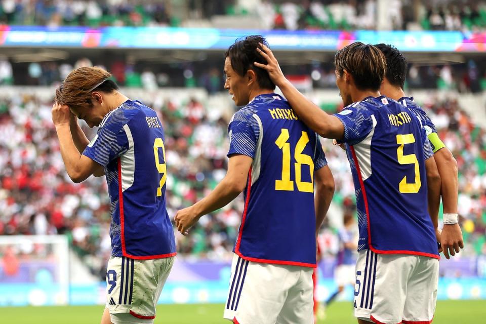 Japan celebrate Ayase Ueda's goal which put them 3-1 up against Bahrain (Getty Images)