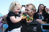 <p>Gold medalist Mahé Drysdale of New Zealand celebrates with daughter Bronte after the medal ceremony for the men’s single sculls.</p>