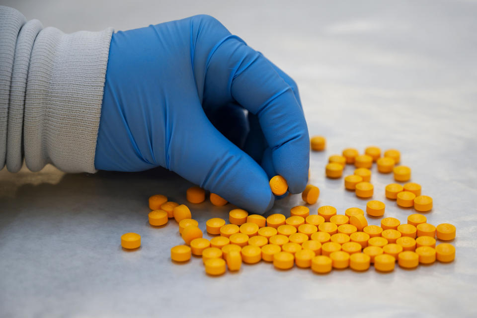 Image: A Drug Enforcement Administration chemist checks confiscated pills containing fentanyl at the DEA Northeast Regional Laboratory on Oct. 8, 2019 in New York. (Don Emmert / AFP via Getty Images file)