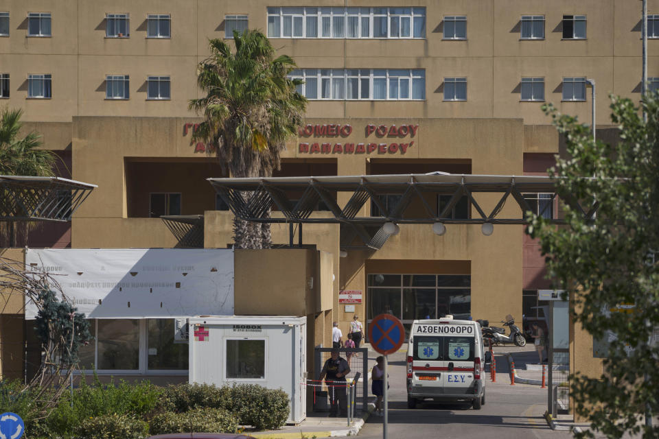 An ambulance drives through the entrance of a state-run hospital on the island of Rhodes, where the body of British TV presenter Michael Mosley was taken following his death while on vacation on the nearby island of Symi, on Monday, June 10, 2024. Family members have traveled to Rhodes to receive the results of an autopsy to establish the cause of death of the 67-year-old presenter. (AP Photo/Petros Giannakouris)