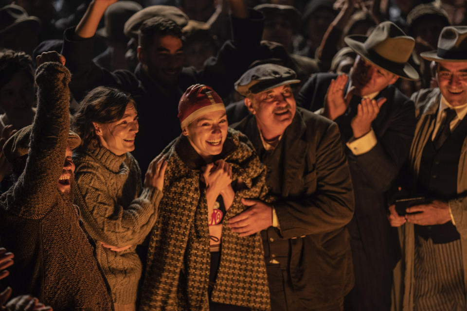 This image released by Disney shows, Jeanette Hain as Gertrud Ederle, from second left, Daisy Ridley as Trudy Ederle, and Kim Bodnia as Henry Ederle in a scene from "Young Woman and the Sea." (Vladisav Lepoev/Disney via AP)