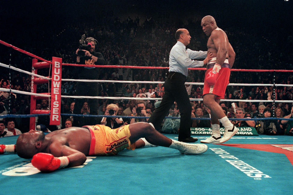 George Foreman, Michael Moorer. Image: JOHN GURZINSKI/AFP via Getty Images