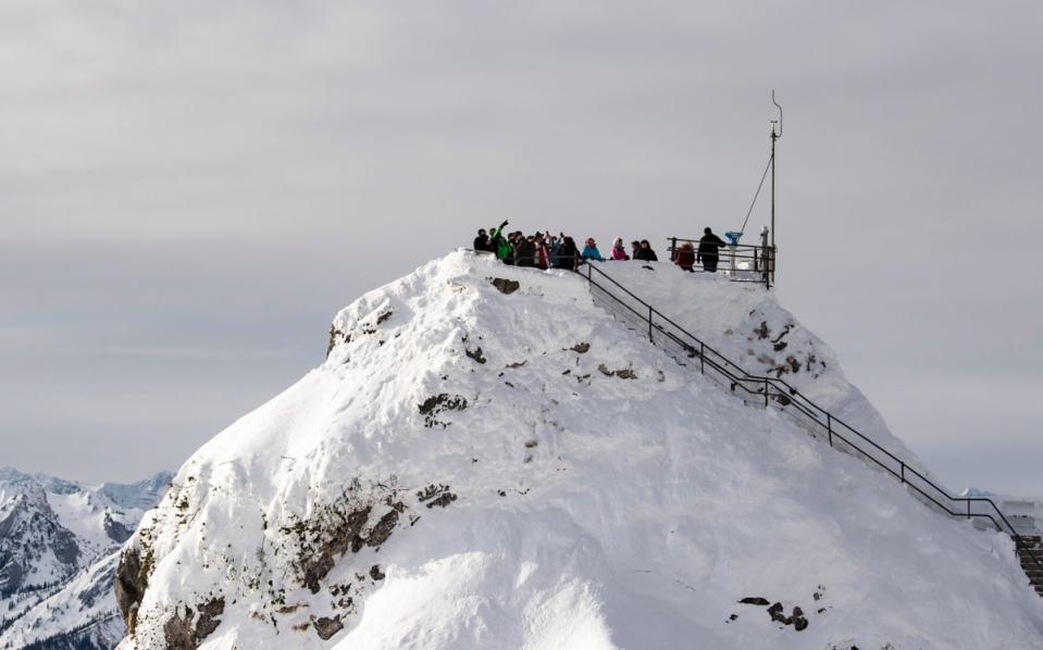 Germany: Tourists stand on a view point at the 1838 metres high Wendelstein mountain near Bayrischzell, Bavaria (EPA)