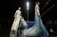 Models wear creations part of the Alberta Ferretti women's Spring-Summer 2013 collection that was presented in Milan, Italy, Wednesday, Sept. 19, 2012. (AP Photo/Luca Bruno)