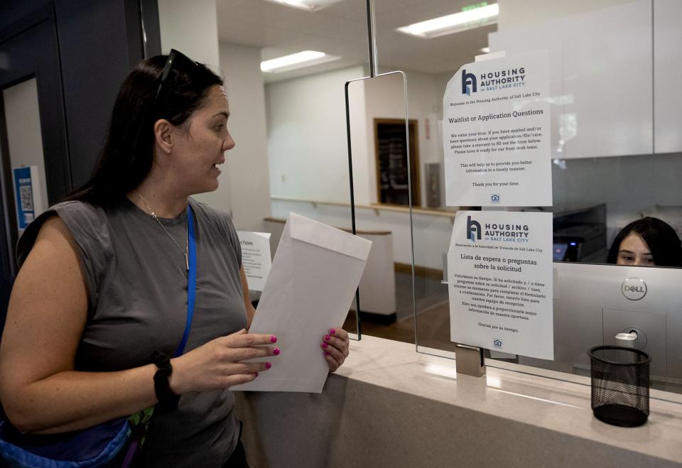 Sara Price delivers a collective letter to the president of HAME demanding an end to the rent increase and the opportunity to negotiate collectively for a fair lease at the office of the Housing Authority of Salt Lake City on Friday, June 30, 2023. | Laura Seitz, Deseret News
