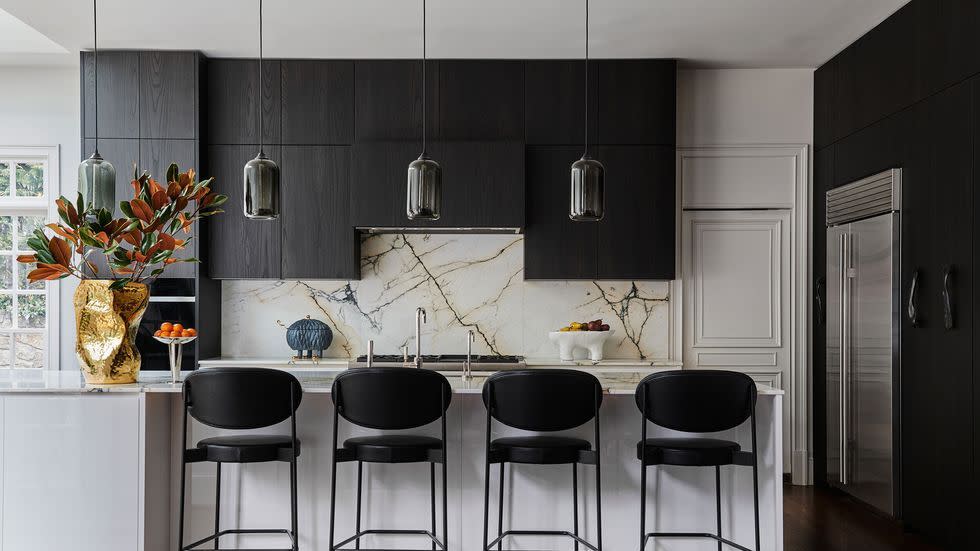 a kitchen with black cabinets