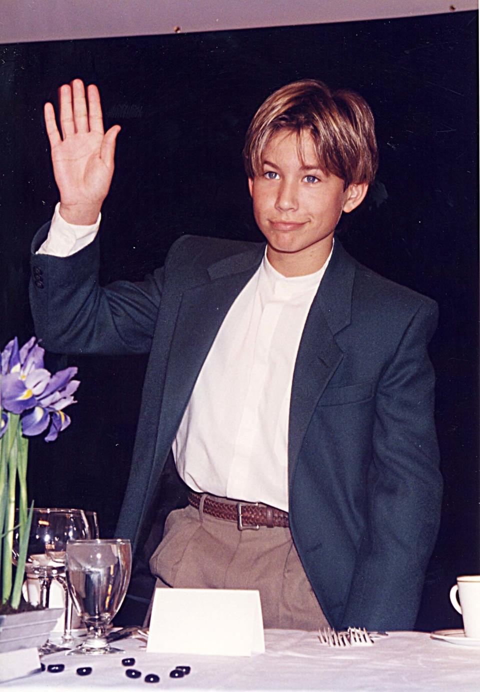 Jonathan Taylor Thomas waves during ShoWest '96 in Las Vegas, Nevada, United States