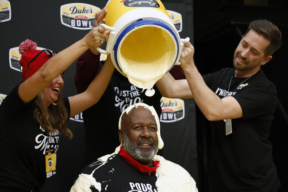 CHARLOTTE, NORTH CAROLINA - DECEMBER 30: Head coach Mike Locksley of the Maryland Terrapins is dunked with Duke's Mayo after defeating the North Carolina State Wolfpack 16-12 during the Duke's Mayo Bowl at Bank of America Stadium on December 30, 2022 in Charlotte, North Carolina. (Photo by Jared C. Tilton/Getty Images)