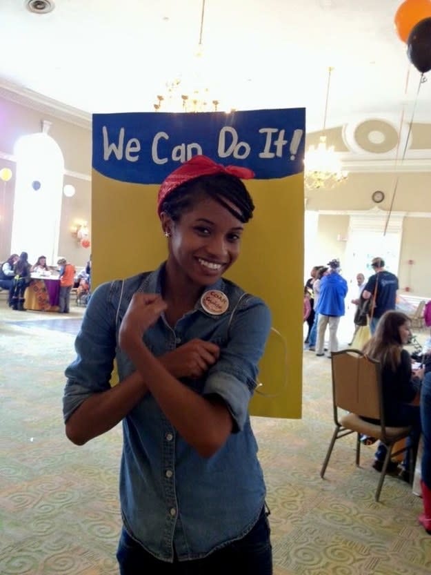 girl in a blue button down shirt and red bandana