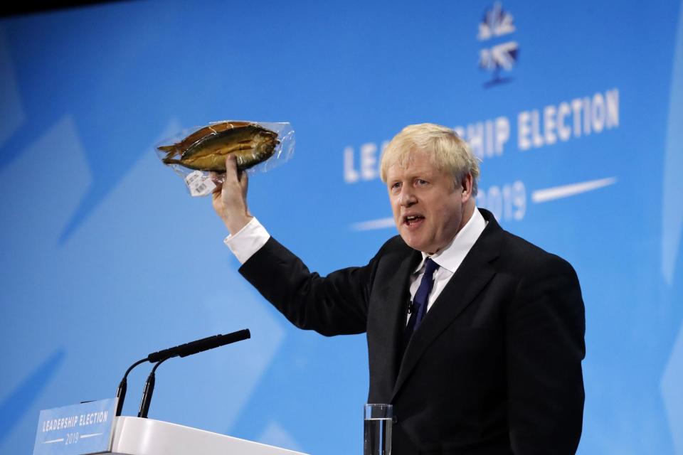 Boris Johnson holds up kipper fish in plastic packaging as he blasts EU food rules (AFP/Getty Images)