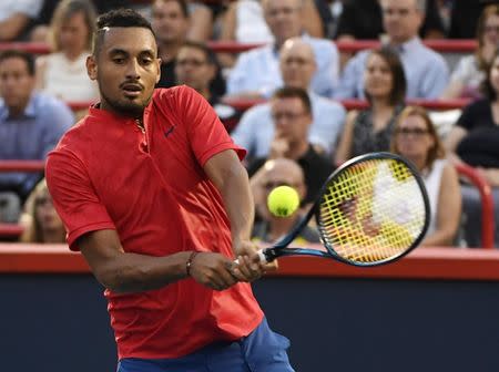 FILE PHOTO -Aug 10, 2017; Montreal, Quebec, Canada; Nick Kyrgios of Australia hits a backhand against Alexander Zverev of Germany (not pictured) during the Rogers Cup tennis tournament at Uniprix Stadium. Mandatory Credit: Eric Bolte-USA TODAY Sports -