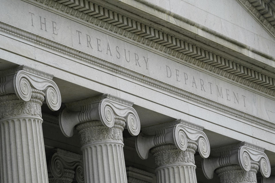 FILE - This May 4, 2021, photo shows the Treasury Building in Washington. The Treasury Department has unveiled plans to borrow $673 billion in the current quarter while employing emergency measures to keep the government from an unprecedented default on the national debt. The department said Monday, Aug. 2, 2021 that its plans for borrowing in the July-September period assume Congress will pass either a suspension of the current debt limit or an increase in the limit. (AP Photo/Patrick Semansky, File)