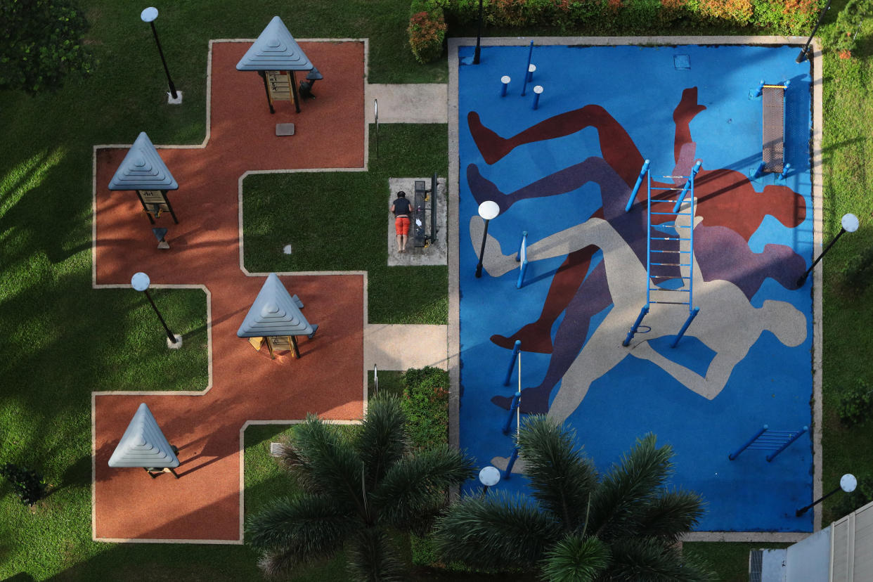 A man exercises at a fitness corner on June 24, 2021 in Singapore. On June 21, Singapore entered into a calibrated easing of social management measures as local community COVID-19 cases remain under control. (Photo by Suhaimi Abdullah/NurPhoto via Getty Images)