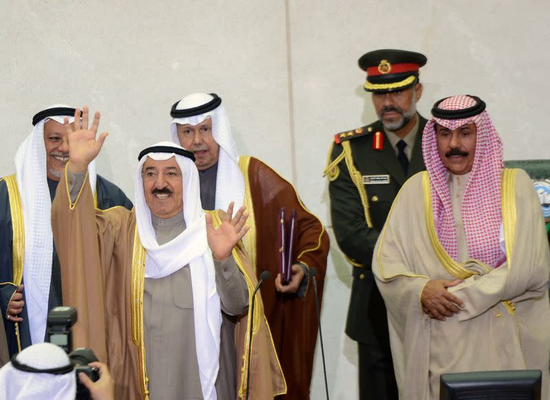 Emir Sheikh Sabah al-Ahmad al-Sabah waves as he finishes opening the 14th session of Parliament in Kuwait City