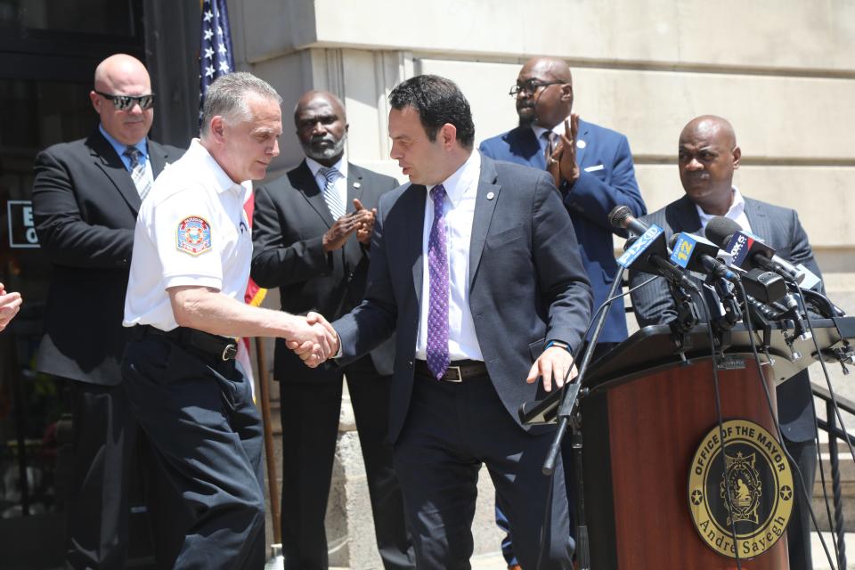 Paterson Police Director Jerry Speziale speaks with Mayor Andre Sayegh of Paterson as six mayors gathered to talk about the impact of bail reform on urban communities in New Jersey and advocate for amendments to the Bail Reform Act. They are part of the New Jersey Urban Mayors Association and met in front of City Hall in Paterson on June 15, 2021.