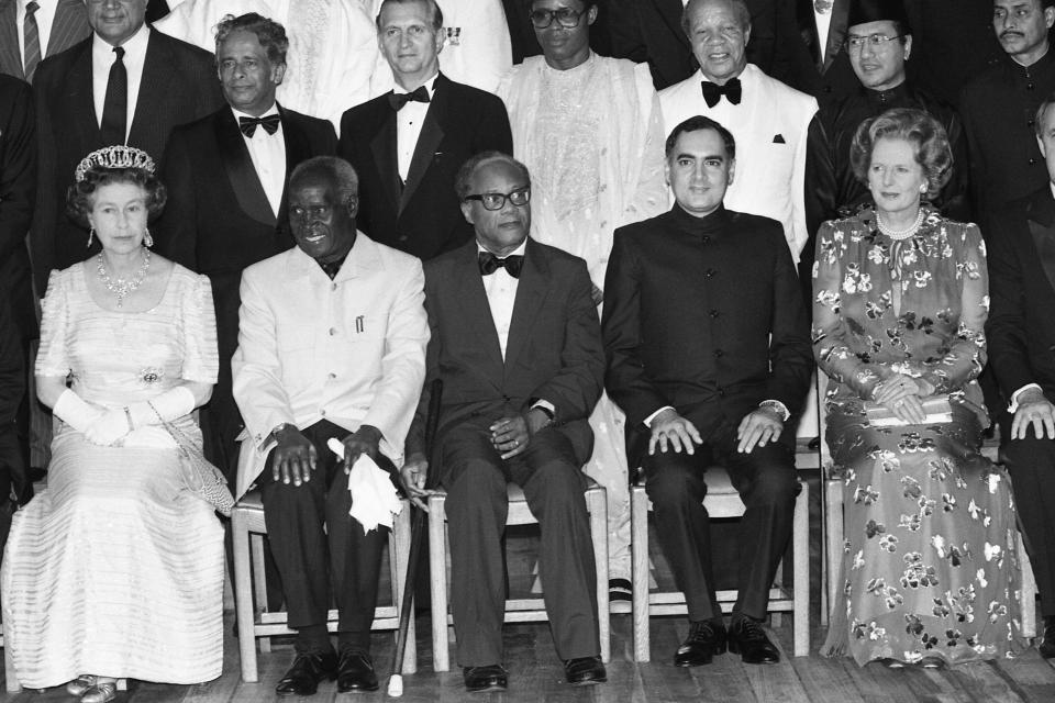 FILE - In this Oct. 16, 1985 file photo, Britain's Queen Elizabeth II, left, sits with former Zambian President, Kenneth Kaunda, second left, and Britain's Prime Minister Margaret Thatcher, right, during an official photo session aboard the Queen's yacht Britannia, in Nassau, the Bahamas, as leaders from 46 countries gathered for the Commonwealth Head of Government meeting. Zambia’s first president Kenneth Kaunda has died at the age of 97, the country's president Edward Lungu announced Thursday June 17, 2021. (AP Photo/Dave Caulkin, File)