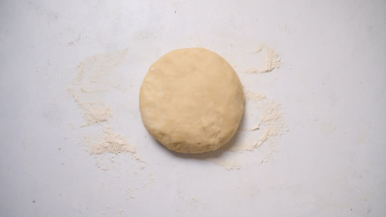 disc of dough on table