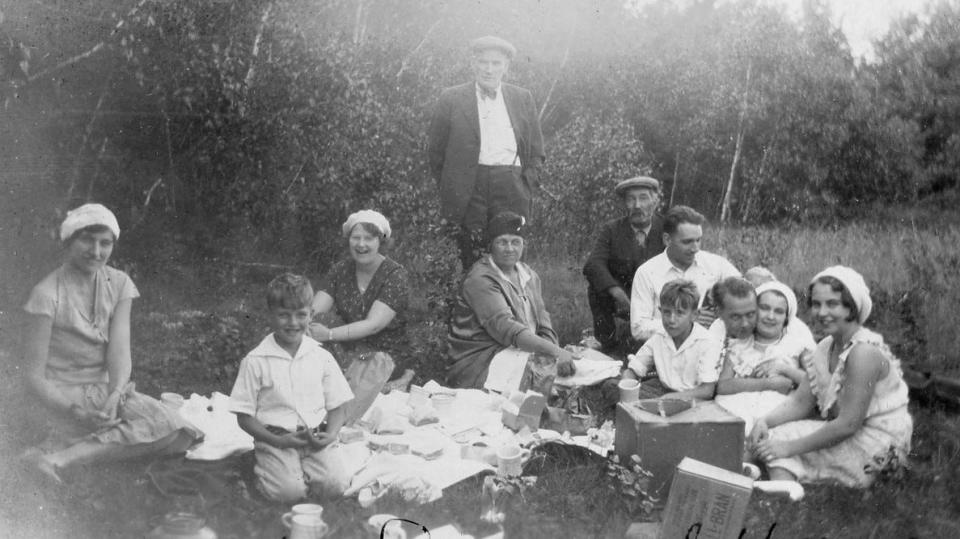 A family enjoying a picnic in 1931. Earlier picnics entailed a lot of work to pull off.