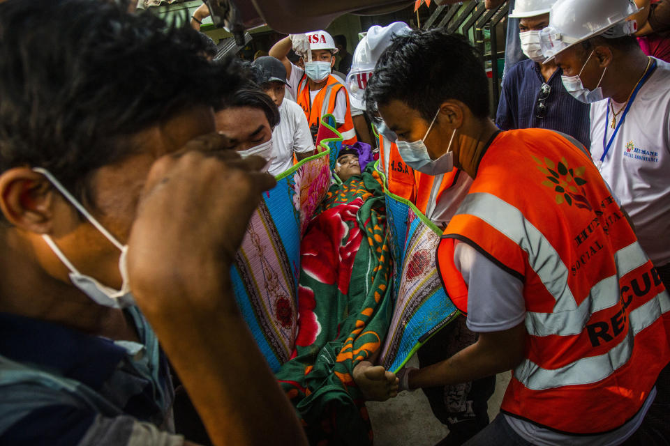 People carry the body of Chit Min Thu in Yangon, Myanmar Thursday, March 11, 2021. Chit Min Thu was fatally shot in the head by Myanmar security forces during an anti-coup protest on Thursday. (AP Photo)