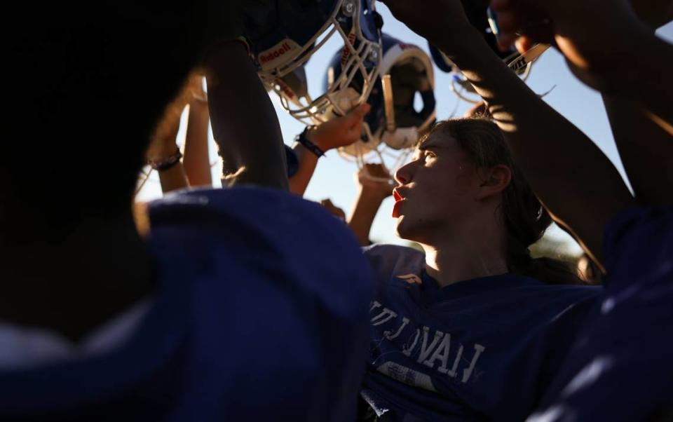 Sullivan Falcons Joe Schmidt leads a huddle during practice at Sullivan Middle School in Fort Mill, S.C., on Tuesday, October 24, 2023. Jo is 13-year-old Girl who plays quarterback, middle linebacker, defensive end, kicker as well as a running back.