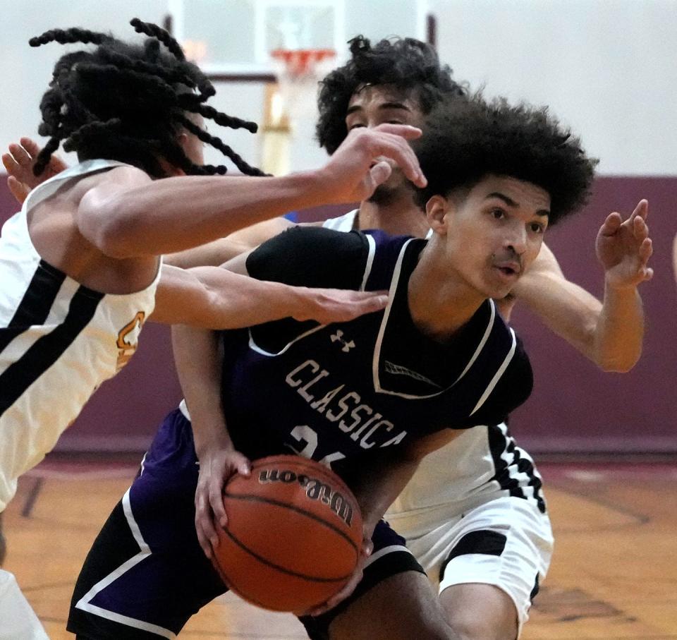 Classical's Eliezer Delbrey, in action last season, had 19 points for the Purple in their win over Cranston East on Friday night.