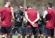 FILE - In this Tuesday, July 3, 2018 photo Michael Koellner, head coach of the German first division, Bundesliga, team 1. FC Nuremberg talks to players during the new season's first training session in Nuremberg, Germany. (Timm Schamberger/dpa via AP, file)