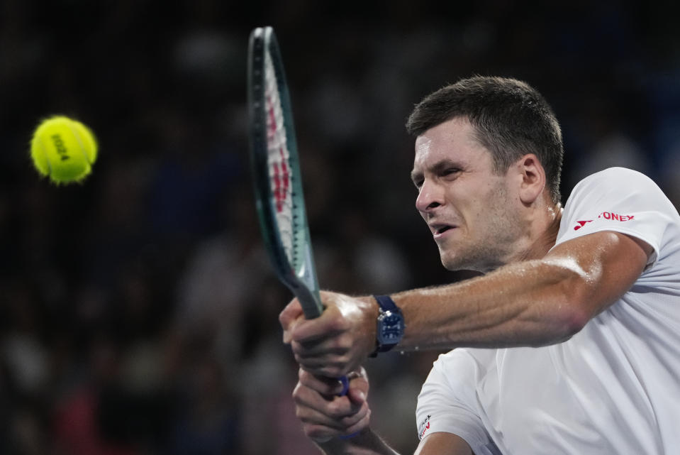 Poland's Hubert Hurkacz plays a backhand return to Germany's Alexander Zverev during the final of the United Cup in Sydney, Australia, Sunday, Jan. 7, 2024. (AP Photo/Mark Baker)