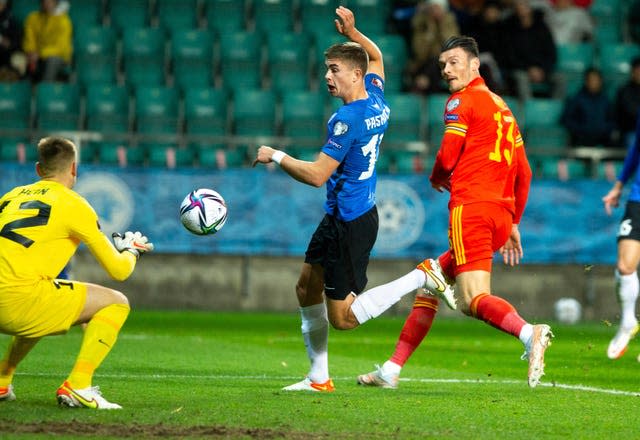 Estonia’s goalkeeper Karl Hein, left, makes a save 