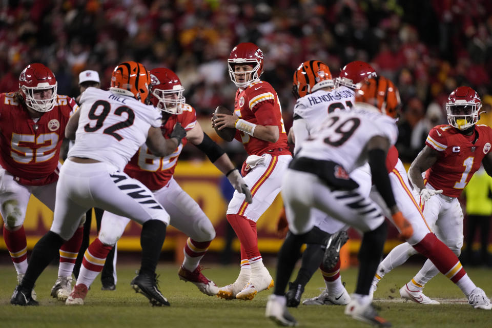 Kansas City Chiefs quarterback Patrick Mahomes (15) works in the pocket against the Cincinnati Bengals during the first half of the NFL AFC Championship playoff football game, Sunday, Jan. 29, 2023, in Kansas City, Mo. (AP Photo/Jeff Roberson)