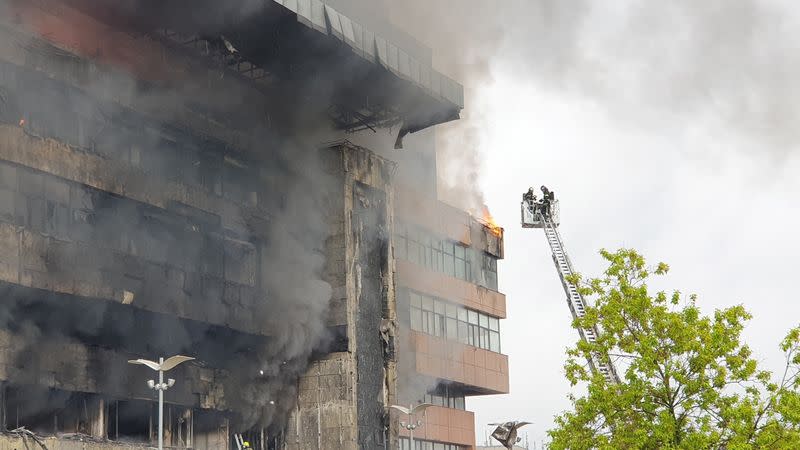 Firefighters extinguish a fire at a business centre in Moscow