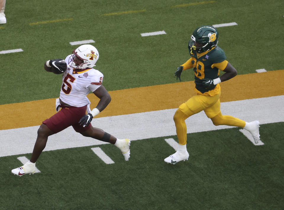 Iowa State running back Cartevious Norton (5) scores a touch down past Baylor safety Devyn Bobby (28) in the second half of an NCAA college football game, Saturday, Oct. 28, 2023, in Waco, Texas. (Jerry Larson/Waco Tribune-Herald via AP)