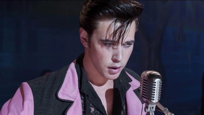 Austin Butler as Elvis singing on stage in a scene from the film