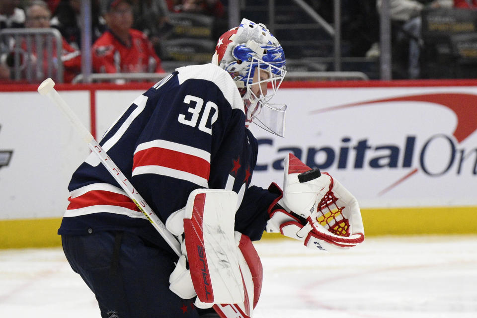 Washington Capitals goaltender Ilya Samsonov (30) stops the puck during the second period of an NHL hockey game against the New York Islanders, Tuesday, April 26, 2022, in Washington. (AP Photo/Nick Wass)