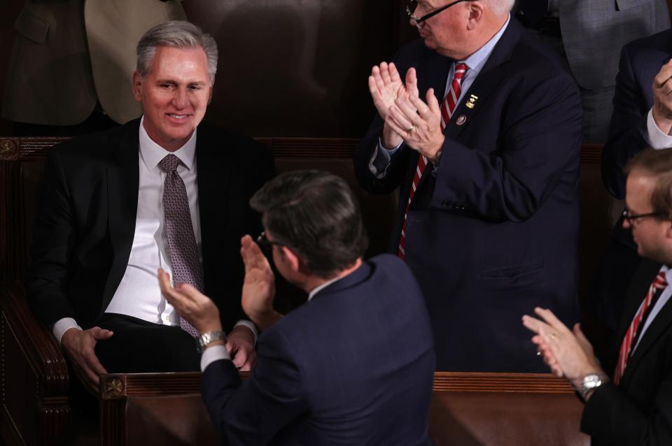 Fellow lawmakers applaud as former Speaker of the House Kevin McCarthy (R-CA) (L) casts his vote as the House of Representatives holds an election for a new Speaker of the House at the U.S. Capitol on October 25, 2023 in Washington, DC. After a contentious nominating period that has seen four candidates over a three-week period, the House GOP conference selected Rep. Mike Johnson (R-LA) as their most recent nominee to succeed former Speaker Kevin McCarthy (R-CA), who was ousted on October 4 in a move led by a small group of conservative members of his own party.