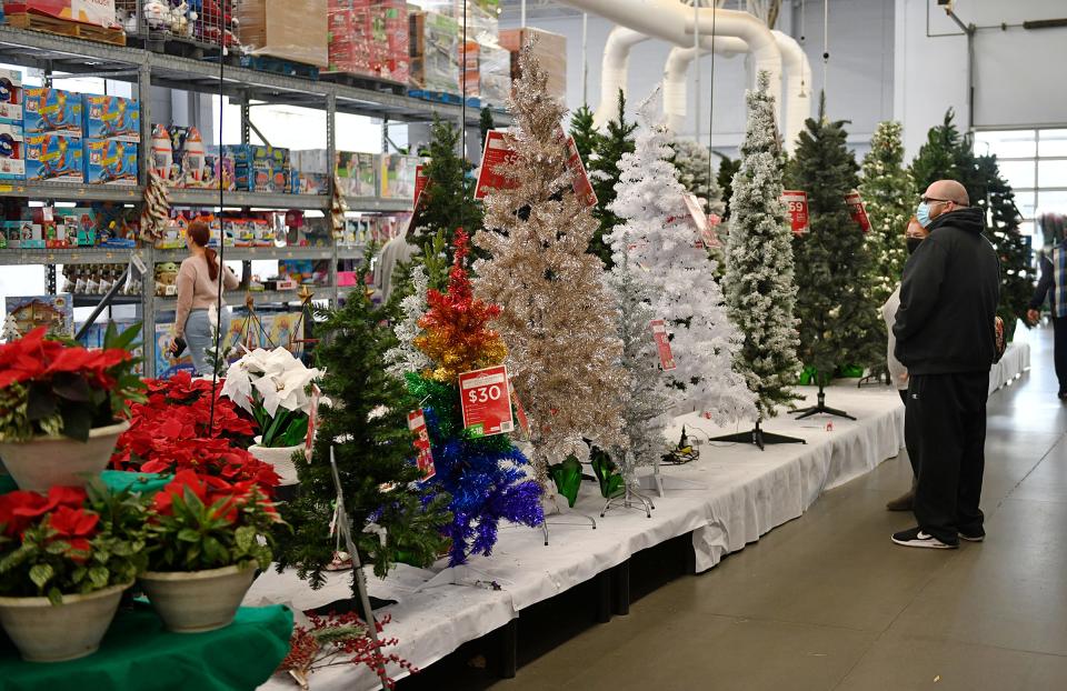 Shoppers at the Walmart on Landis Avenue in Vineland look at Christmas trees on Black Friday. Nov. 26, 2021.