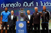 Football club Leicester City captain (L-R) Wes Morgan, vice chairman Vichai Srivaddhanaprabha, owner Vichai Srivaddhanaprabha, manager Claudio Ranieri and player Kasper Schmeichel stand on stage next to the club's English Premier League trophy during a meeting with the media in Bangkok, Thailand May 18, 2016. REUTERS/Jorge Silva