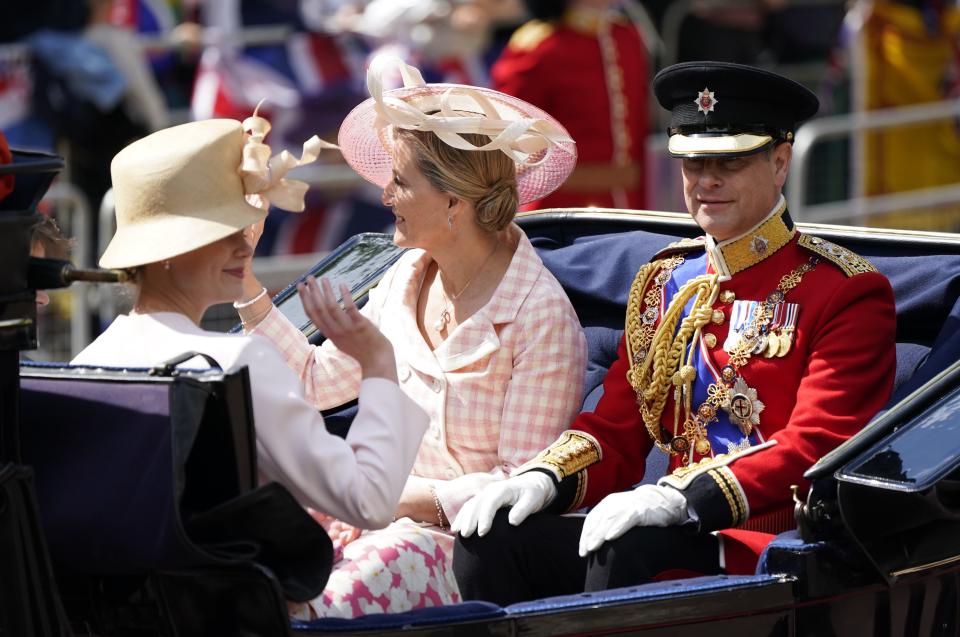The Earl and Countess of Wessex ride in a carriage as the Royal Procession leaves Buckingham Palace for the Trooping the Colour.